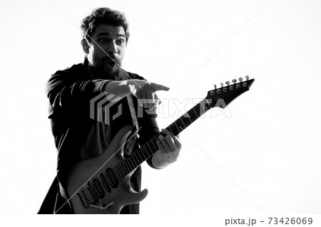 Musician with guitar rock star emotions entertainment modern performer Musician with guitar rock star emotions entertainment modern performer 73426069