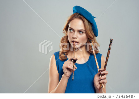 woman artist brush in hand blue beret dress hobby art lifestyle light background woman artist brush in hand blue beret dress hobby art lifestyle light background 73426487