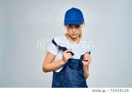 Working woman in uniform courier delivery service lifestyle Working woman in uniform courier delivery service lifestyle 73428129