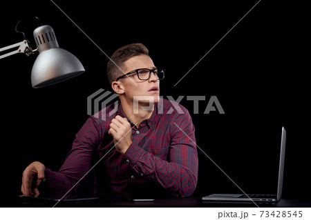 Male manager indoors dark background communication red shirt model glasses new technologies business finance 73428545