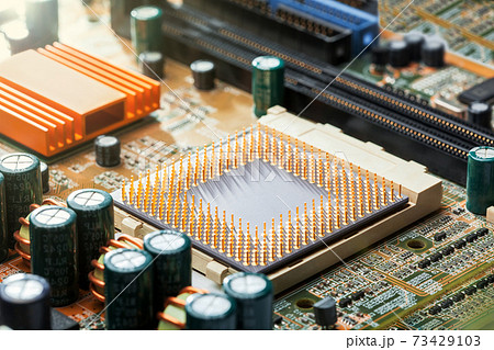 cpu with legs on the motherboard socket, chip upgrade closeup, nobody. cpu with legs on the motherboard socket, chip upgrade closeup, nobody. 73429103