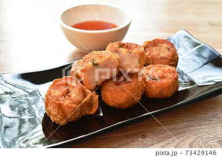 deep fried mashed crab meat and pork roll Chinese food on plate dipping sweet plum sauce deep fried mashed crab meat and pork roll Chinese food on plate dipping sweet plum sauce 73429146