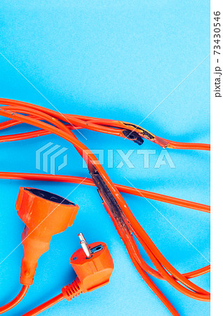 burnt electrical wire on blue background. Copy space burnt electrical wire on blue background. Copy space 73430546
