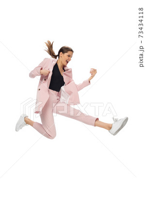 Happy young woman dancing in stylish clothes or suit, remaking legendary moves of celebrity from culture history 73434118