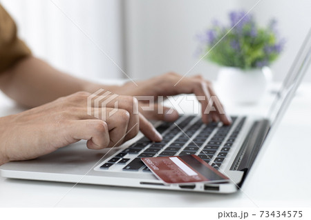 Men use laptop to register online purchases using credit card payments, Convenience in the world of technology and the internet, Shopping online and banking online concept. 73434575