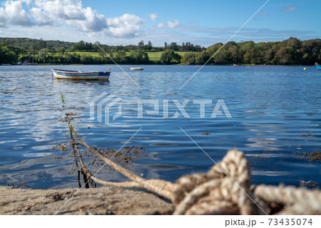 Rowing boat at the pier in Bruckless in County Donegal - Ireland. Rowing boat at the pier in Bruckless in County Donegal - Ireland. 73435074