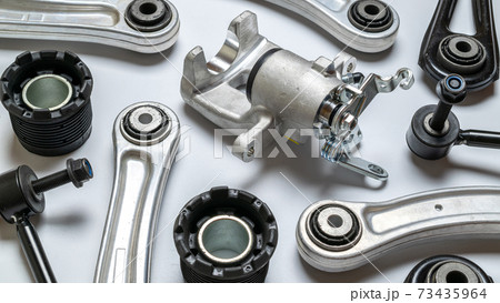 Car service. Auto motor mechanic spare or automotive piece on white background. Set of new metal car part. Technology of mechanical gear. 73435964