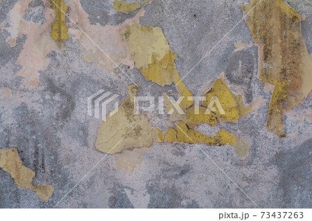 Grey weathered concrete wall with yellow paint texture, old rustic, free space for text or advertisement Grey weathered concrete wall with yellow paint texture, old rustic, free space for text or advertisement 73437263