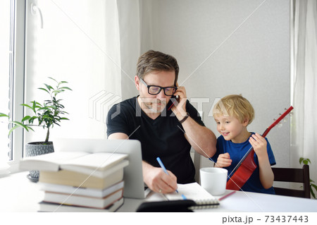 Man working from home with laptop during quarantine.  73437443
