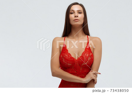 Sexy woman in lace bodysuit in studio 73438050