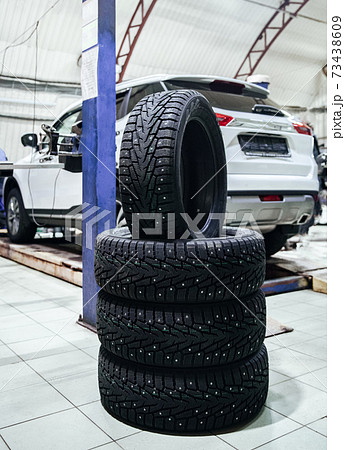 set of new car wheels at a shallow depth of field 73438609