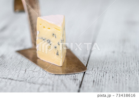 Blue cheese with white mould Blue cheese with white mould 73438616
