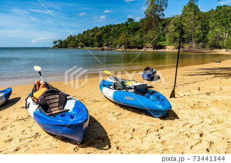 Blue kayaks on the beach 73441344