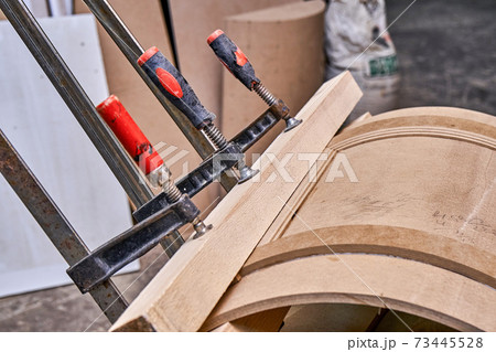 Curved cabinet door. Wooden furniture manufacturing process Curved cabinet door. Wooden furniture manufacturing process 73445528