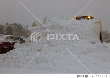 Winter the snow removal vehicle removing snow way after heavy snowfall 73445793