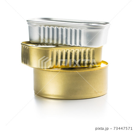 Three closed cans of sardines. Three closed cans of sardines. 73447571