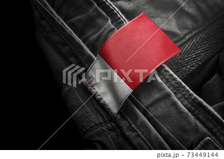 Tag on dark clothing in the form of the flag of the Malta 73449144