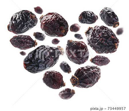Dried rosehip berries in the shape of a heart on a white background Dried rosehip berries in the shape of a heart on a white background 73449957