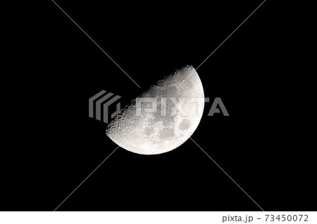 Half moon in a dark sky 73450072