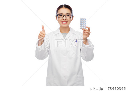 smiling asian female doctor or nurse with medicine smiling asian female doctor or nurse with medicine 73450346