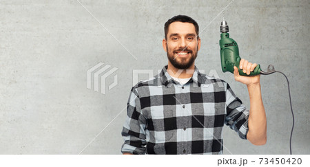 happy man, worker or builder with drill 73450420