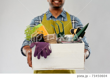 indian gardener or farmer with box of garden tools indian gardener or farmer with box of garden tools 73450604