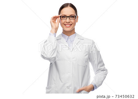 smiling female doctor in glasses and white coat smiling female doctor in glasses and white coat 73450632