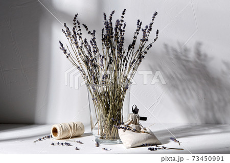 sachet bag, rope and lavender flowers in vase sachet bag, rope and lavender flowers in vase 73450991