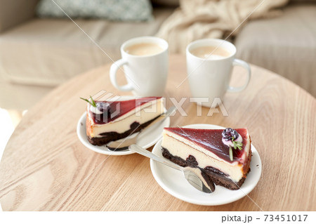 pieces of chocolate cake on wooden table pieces of chocolate cake on wooden table 73451017