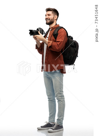 happy man or photographer with camera and backpack 73451648