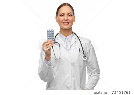 smiling female doctor holding medicine pills smiling female doctor holding medicine pills 73451761