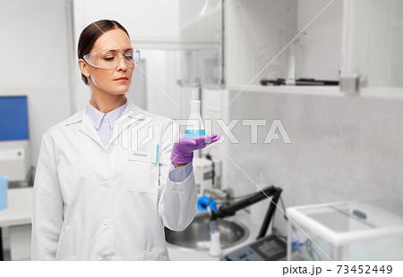 female scientist with chemical at laboratory female scientist with chemical at laboratory 73452449