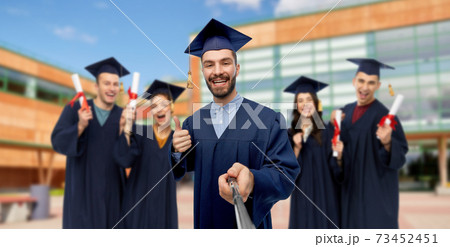 male graduate student taking selfie with monopod 73452451