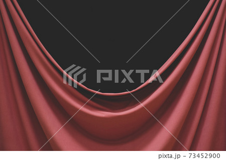 Detail of draped fabric, focus on folds and creases with black background 73452900