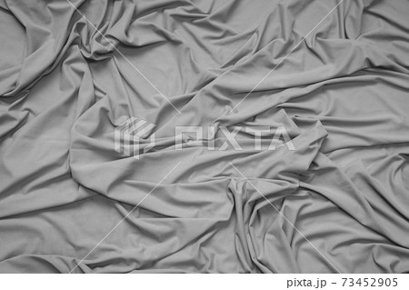 Detail of crumpled cloth bedding 73452905