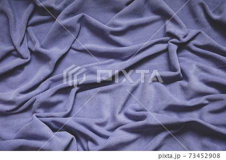 Detail of crumpled fleece blanket, focus in folds and creases 73452908
