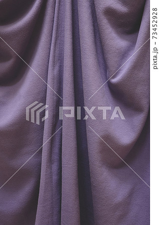 Detail of draped fleece blanket with folds and creases 73452928