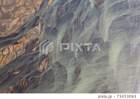 Aerial view of Hosa river coloured by glacial melt, SW Iceland 73453063
