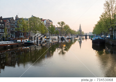 The Oudeschans canal in Amsterdam with the Montelbaanstoren tower in the background 73453068