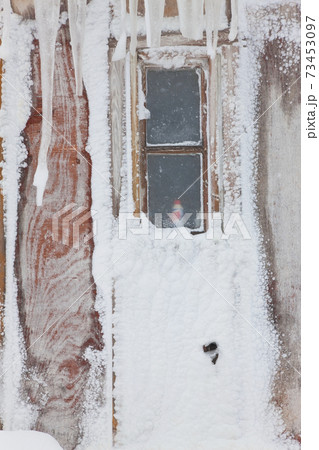 Ice framed windows of a house in a village in Greenland Ice framed windows of a house in a village in Greenland 73453097