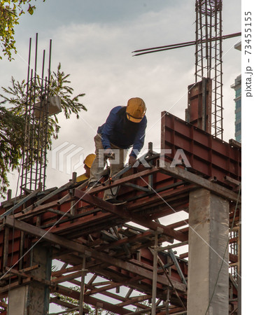 Construction Worker Welding soldering metal girders and Sparks. Construction Worker Welding soldering metal girders and Sparks. 73455155