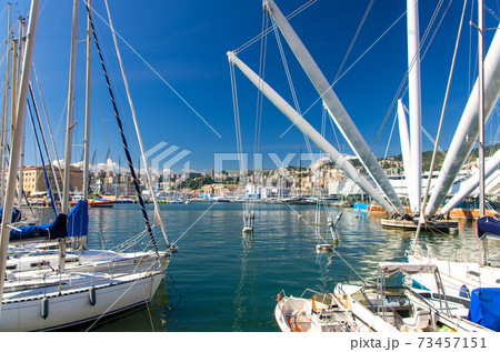 Port Porto Antico harbor with luxury white yachts and attractions, Bigo construction in historical centre of old european city Genoa 73457151