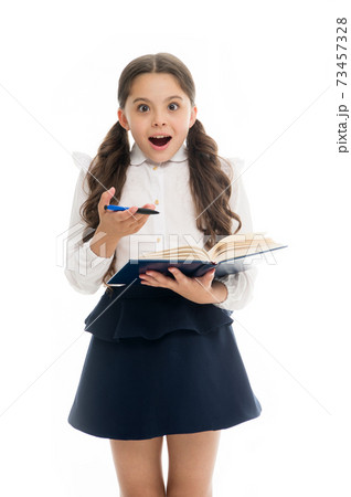 Schoolgirl with surprised look isolated on white. Little  73457328