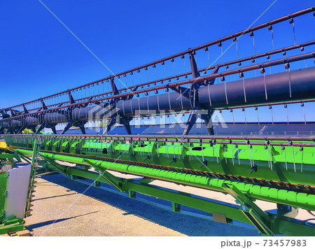 Big harvester in the field on a autumn sunny day 73457983