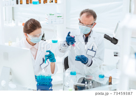 close up. researchers work with tests in the laboratory. 73459387