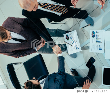 top view. business people greeting each other before the meeting. top view. business people greeting each other before the meeting. 73459437