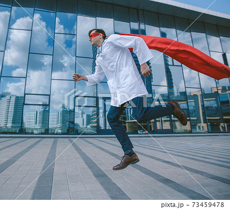 medic superhero hurries to the sick city resident. 73459478