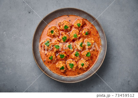 Sulu Kofte in gray bowl on concrete table top. Turkish cuisine soup dish with beef meatballs 73459512