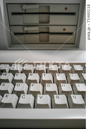 Antique computer keyboard and 5 inch disk drives Antique computer keyboard and 5 inch disk drives 73460218