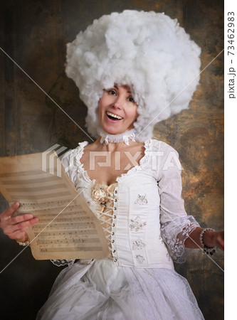 Lady dressed in Baroque style clothes with notes Lady dressed in Baroque style clothes with notes 73462983